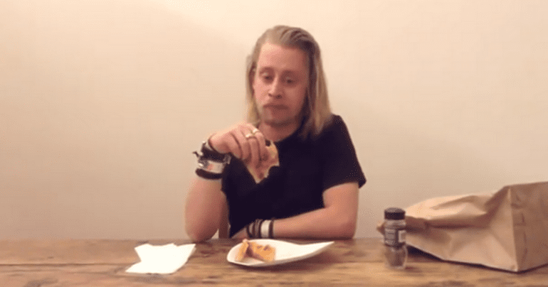 Macaulay-Culkin-Eating-a-Slice-of-Pizza