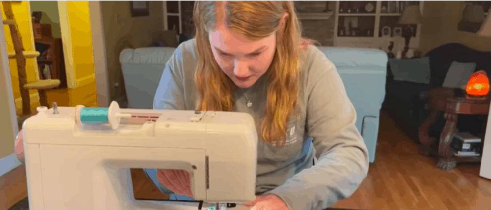 Lawrence Sewing a Mask